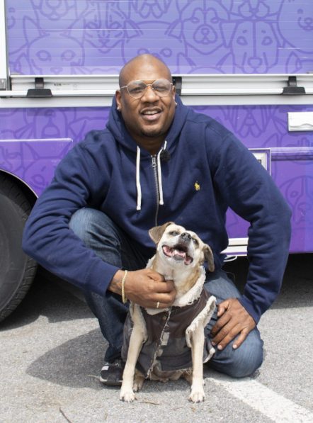 Man and his dog at pet food pantry Man and his dog pick up free pet food at pet food pantry